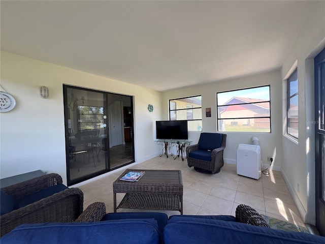 tiled living room featuring baseboards