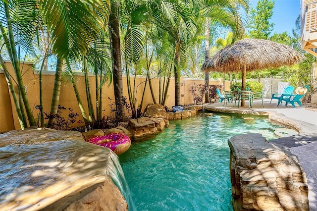 view of swimming pool featuring a fenced backyard, a patio, and a fenced in pool