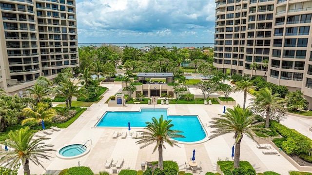 1211 Gulf Of Mexico Dr Unit 309, Longboat Key, FL 34228 - community pool with view of wooded area