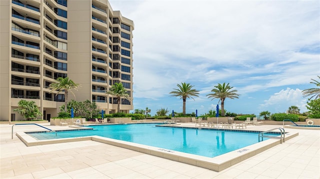 1211 Gulf Of Mexico Dr Unit 309, Longboat Key, FL 34228 - community pool featuring a patio