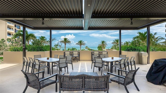 1211 Gulf Of Mexico Dr Unit 309, Longboat Key, FL 34228 - view of patio / terrace with outdoor dining space and a grill