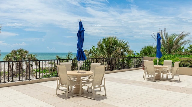 1211 Gulf Of Mexico Dr Unit 309, Longboat Key, FL 34228 - view of patio with outdoor dining area and a water view