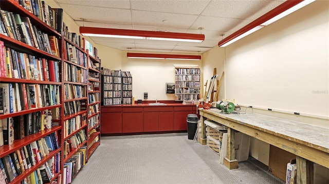 1211 Gulf Of Mexico Dr Unit 309, Longboat Key, FL 34228 - misc room featuring bookshelves, carpet floors, and a paneled ceiling