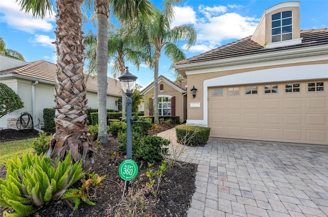 11716 Strandhill Ct, Lakewood Ranch, FL 34202 - view of front facade with decorative driveway, a tile roof, and stucco siding