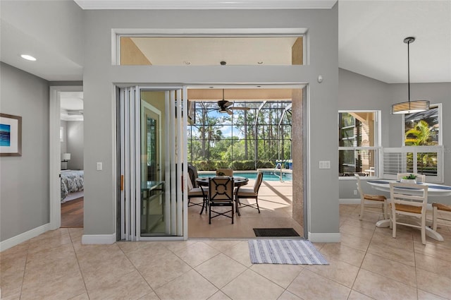 11716 Strandhill Ct, Lakewood Ranch, FL 34202 - dining space featuring baseboards, lofted ceiling, and tile patterned floors