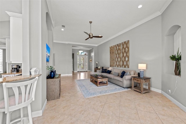 11716 Strandhill Ct, Lakewood Ranch, FL 34202 - living area with light tile patterned floors, ornamental molding, arched walkways, and a ceiling fan