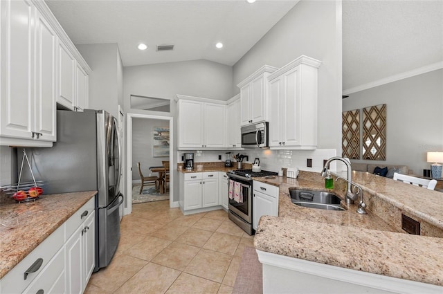 11716 Strandhill Ct, Lakewood Ranch, FL 34202 - kitchen featuring visible vents, white cabinets, a sink, and stainless steel appliances