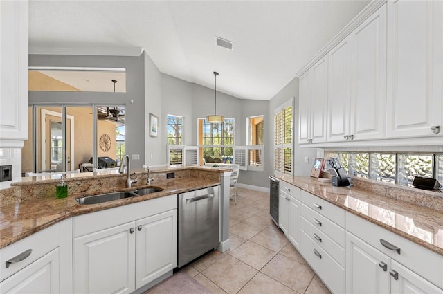 11716 Strandhill Ct, Lakewood Ranch, FL 34202 - kitchen featuring vaulted ceiling, a sink, dishwasher, visible vents, and white cabinets