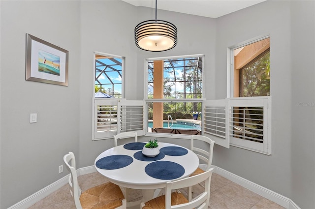 11716 Strandhill Ct, Lakewood Ranch, FL 34202 - dining area featuring light tile patterned flooring and baseboards