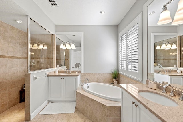 11716 Strandhill Ct, Lakewood Ranch, FL 34202 - full bathroom featuring tile patterned floors, a bath, a sink, and walk in shower