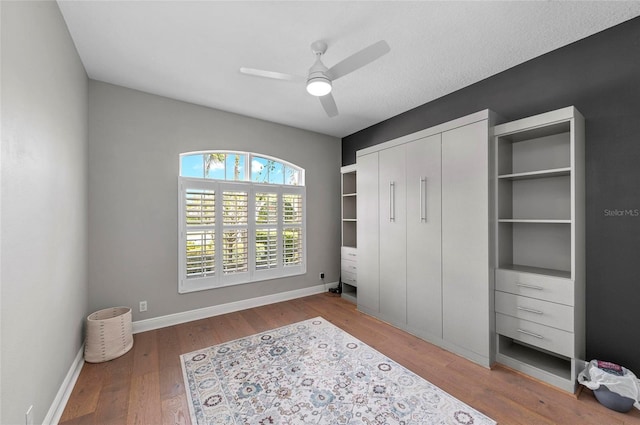 11716 Strandhill Ct, Lakewood Ranch, FL 34202 - bedroom with baseboards, a closet, wood finished floors, and ceiling fan