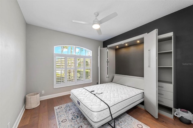 11716 Strandhill Ct, Lakewood Ranch, FL 34202 - bedroom featuring baseboards, wood finished floors, and a ceiling fan