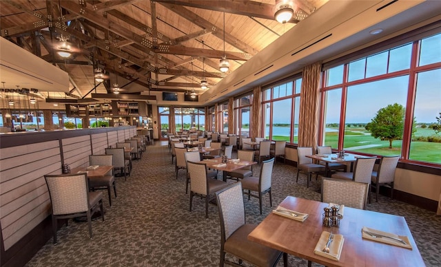 11716 Strandhill Ct, Lakewood Ranch, FL 34202 - carpeted dining space with wooden ceiling, high vaulted ceiling, and beamed ceiling