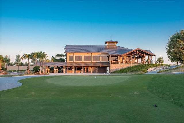 11716 Strandhill Ct, Lakewood Ranch, FL 34202 - rear view of property featuring a standing seam roof and metal roof