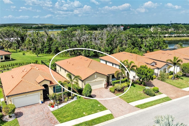 10015 Marbella Dr, Bradenton, FL 34211 - aerial view of property and surrounding area with a nearby body of water and a tree filled landscape