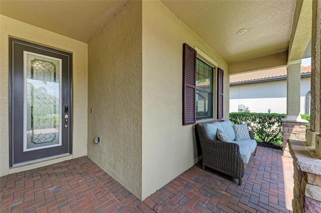 10015 Marbella Dr, Bradenton, FL 34211 - property entrance featuring stucco siding and a porch
