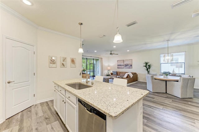 10015 Marbella Dr, Bradenton, FL 34211 - kitchen with dishwasher, light wood-type flooring, recessed lighting, ornamental molding, and white cabinets