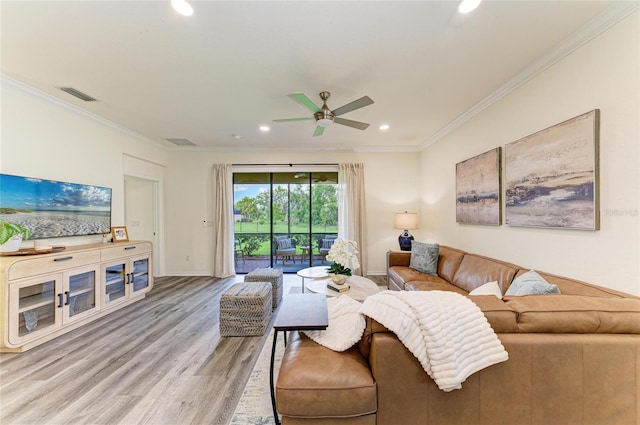 10015 Marbella Dr, Bradenton, FL 34211 - living room featuring recessed lighting, ornamental molding, ceiling fan, and light wood finished floors