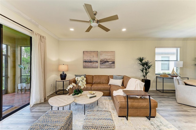 10015 Marbella Dr, Bradenton, FL 34211 - living room with wood finished floors, plenty of natural light, a ceiling fan, ornamental molding, and recessed lighting