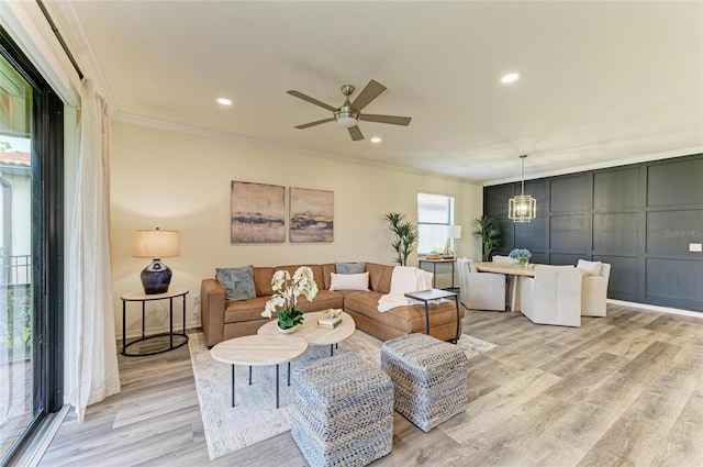 10015 Marbella Dr, Bradenton, FL 34211 - living area with ornamental molding, light wood finished floors, a ceiling fan, and recessed lighting