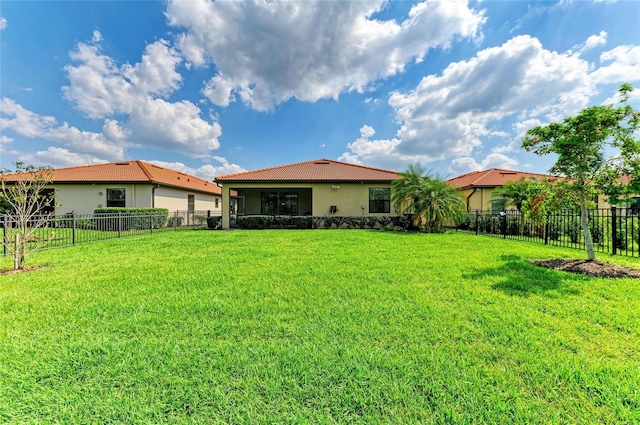 10015 Marbella Dr, Bradenton, FL 34211 - back of house featuring a fenced backyard, stucco siding, and a tiled roof