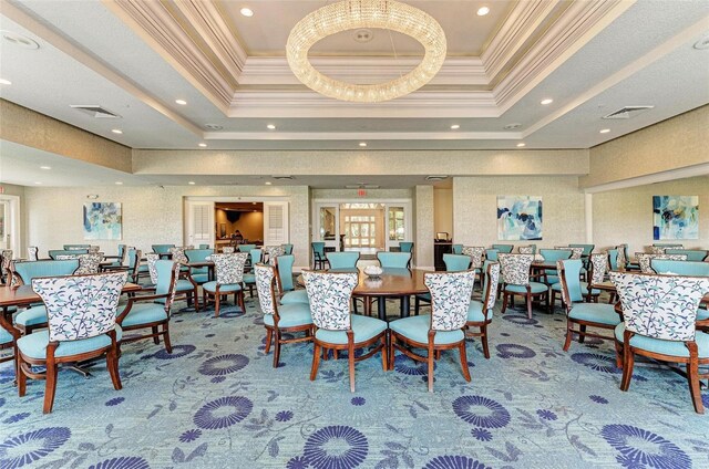 10015 Marbella Dr, Bradenton, FL 34211 - carpeted dining room with a tray ceiling, crown molding, and recessed lighting