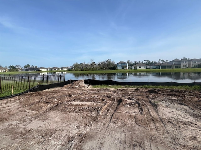 8760 Windlass Cv, Parrish, FL 34219 - view of yard featuring fence, a water view, and a residential view