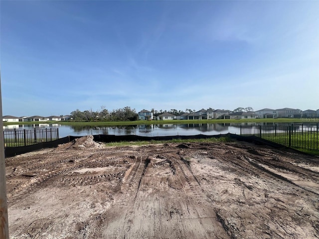 8760 Windlass Cv, Parrish, FL 34219 - view of yard featuring a residential view, fence, and a water view