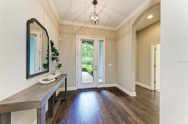 7278 Lismore Ct, Lakewood Ranch, FL 34202 - entrance foyer featuring dark wood-style floors, baseboards, arched walkways, and ornamental molding