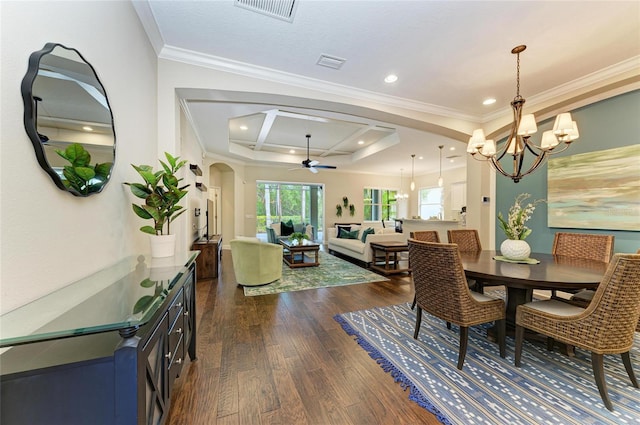 7278 Lismore Ct, Lakewood Ranch, FL 34202 - dining room featuring arched walkways, dark wood finished floors, a chandelier, a ceiling fan, and crown molding