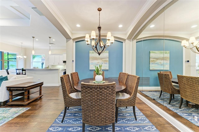 7278 Lismore Ct, Lakewood Ranch, FL 34202 - dining room with a chandelier, dark wood finished floors, ornamental molding, and baseboards