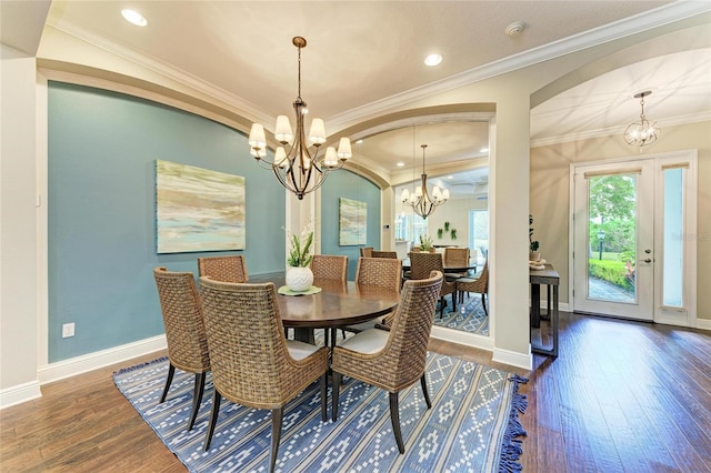 7278 Lismore Ct, Lakewood Ranch, FL 34202 - dining space with a chandelier, dark wood-type flooring, baseboards, recessed lighting, and crown molding