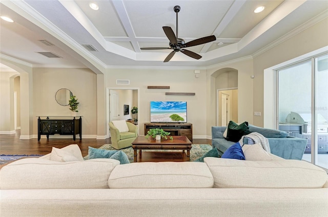7278 Lismore Ct, Lakewood Ranch, FL 34202 - living area with arched walkways, coffered ceiling, a ceiling fan, baseboards, and ornamental molding