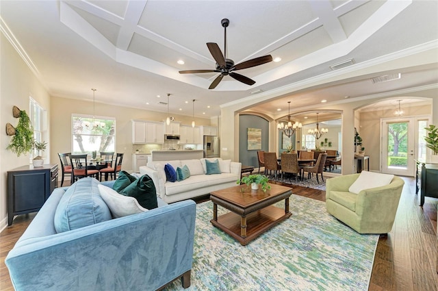 7278 Lismore Ct, Lakewood Ranch, FL 34202 - living room with a chandelier, arched walkways, recessed lighting, wood finished floors, and coffered ceiling