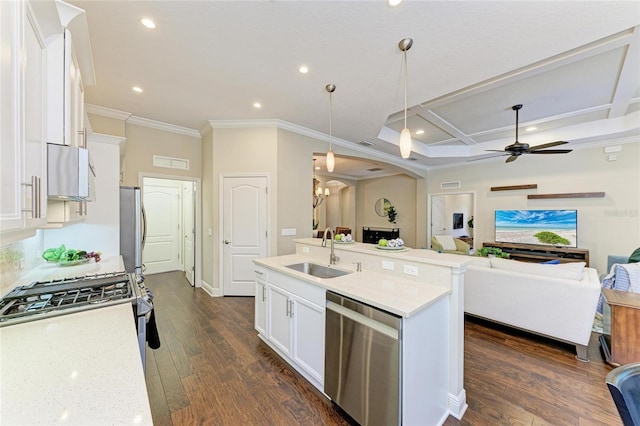 7278 Lismore Ct, Lakewood Ranch, FL 34202 - kitchen featuring stainless steel appliances, a sink, ornamental molding, white cabinetry, and arched walkways