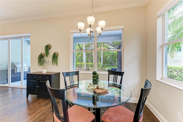 7278 Lismore Ct, Lakewood Ranch, FL 34202 - dining space featuring a chandelier, dark wood-type flooring, crown molding, and baseboards