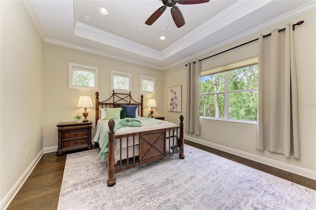 7278 Lismore Ct, Lakewood Ranch, FL 34202 - bedroom featuring dark wood-type flooring, baseboards, crown molding, a raised ceiling, and ceiling fan