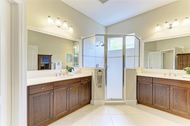 7278 Lismore Ct, Lakewood Ranch, FL 34202 - bathroom with a stall shower, two vanities, and tile patterned floors