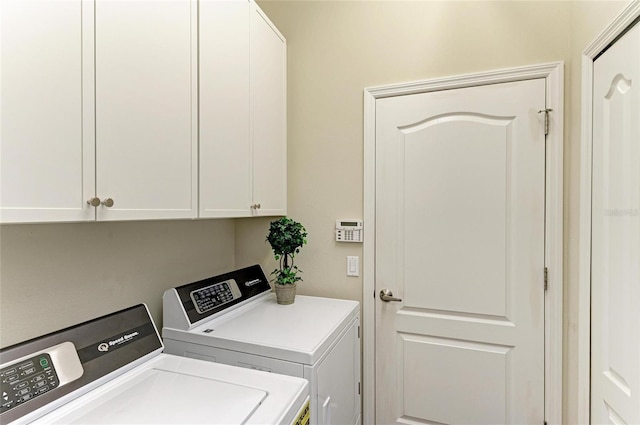 7278 Lismore Ct, Lakewood Ranch, FL 34202 - laundry area with cabinet space and washer and clothes dryer