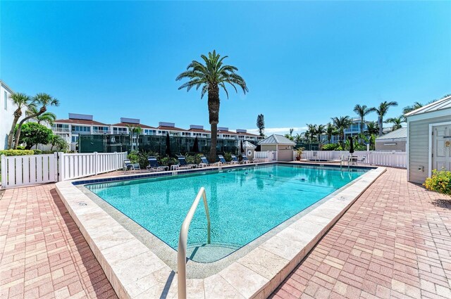 5055 Gulf Of Mexico Dr Unit 422, Longboat Key, FL 34228 - pool with a residential view, a patio area, and fence