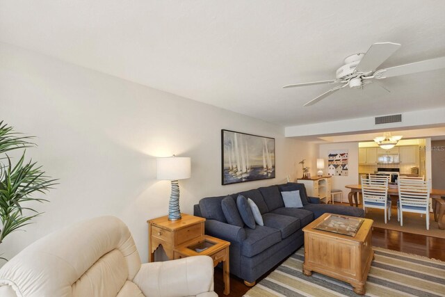 5055 Gulf Of Mexico Dr Unit 422, Longboat Key, FL 34228 - living room featuring a ceiling fan, wood finished floors, and visible vents