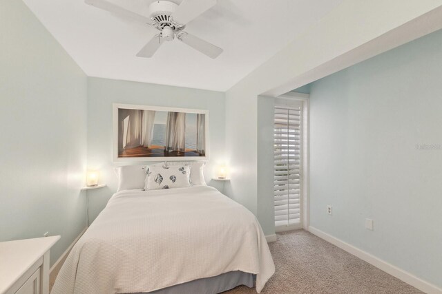 5055 Gulf Of Mexico Dr Unit 422, Longboat Key, FL 34228 - bedroom featuring baseboards, ceiling fan, and light colored carpet