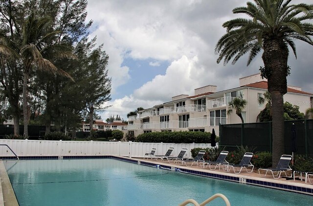 5055 Gulf Of Mexico Dr Unit 422, Longboat Key, FL 34228 - pool featuring fence
