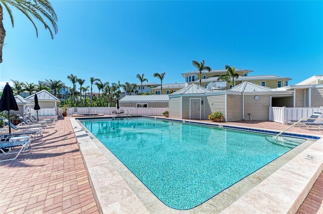 5055 Gulf Of Mexico Dr Unit 422, Longboat Key, FL 34228 - community pool featuring a patio area and fence