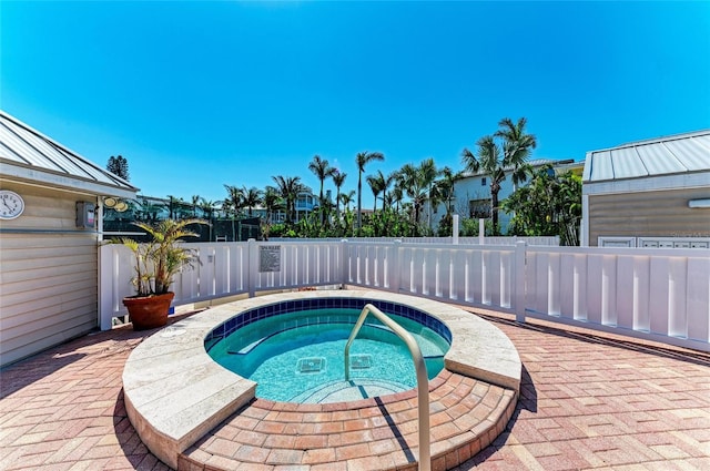5055 Gulf Of Mexico Dr Unit 422, Longboat Key, FL 34228 - view of swimming pool featuring a fenced backyard and an in ground hot tub