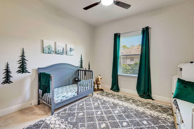 2707 162nd Ave E, Parrish, FL 34219 - bedroom with baseboards, carpet, a crib, and ceiling fan