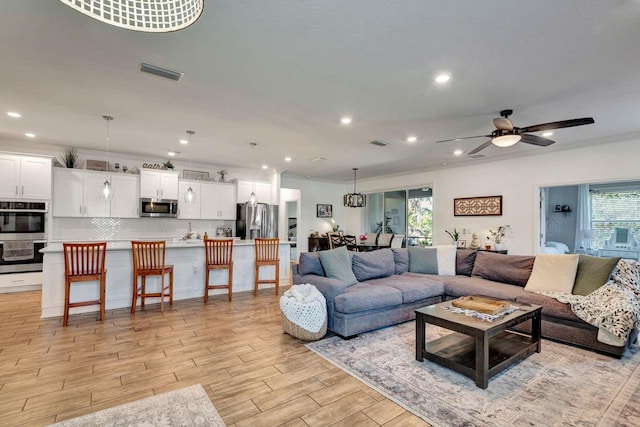 2707 162nd Ave E, Parrish, FL 34219 - living area featuring ceiling fan, recessed lighting, and light wood-style floors