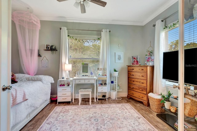 2707 162nd Ave E, Parrish, FL 34219 - bedroom with wood finished floors, ornamental molding, ceiling fan, and baseboards