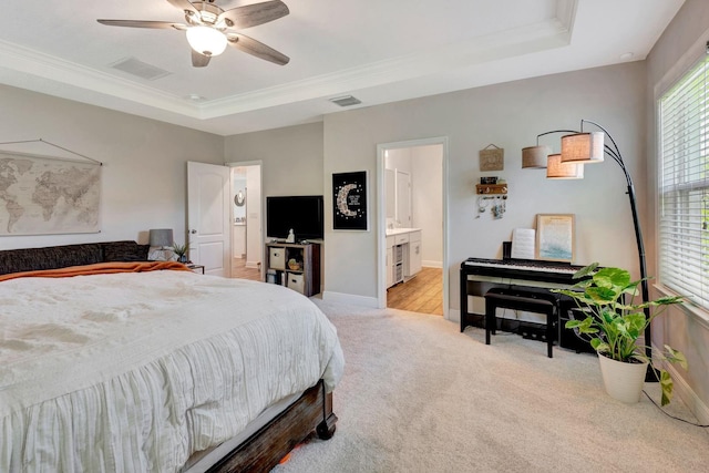 2707 162nd Ave E, Parrish, FL 34219 - bedroom featuring light colored carpet, a raised ceiling, baseboards, crown molding, and a ceiling fan