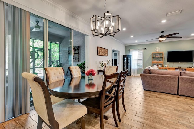 2707 162nd Ave E, Parrish, FL 34219 - dining space featuring ornamental molding, a ceiling fan, light wood-style flooring, recessed lighting, and a chandelier